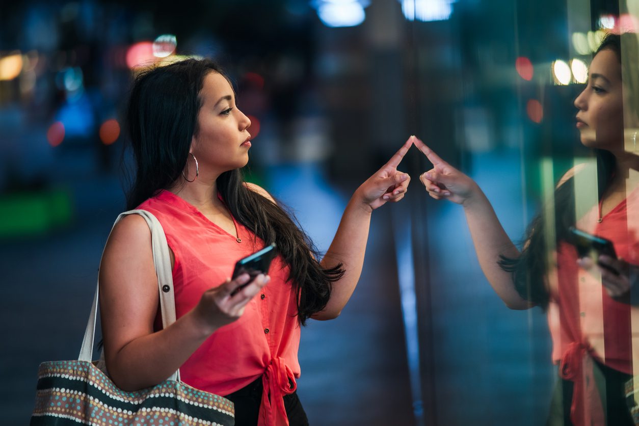 Young woman window shopping.